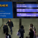 An information board shows Eurostar trains are canceled at St Pancras station in London, Tuesday, June 23, 2015.